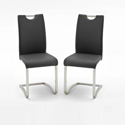 ff2efa6928fc87d86b0b6d0d0a03476bdb34af13a22ab08c0feb888b41e6dbb3.jpg An Image of Koln Dining Chair In Black Faux Leather in A Pair