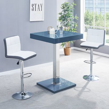 8f19e12a9653d3927deacdec70ccae8197b0a37b94ed6c59728f8ceebf7c35e6.jpg An Image of Topaz Glass Bar Table In Grey With 2 Copez White Grey Stools
