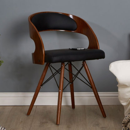 db4ff3b8723648cff11810c06bde17304132b4759bcd7df9cfcbd5c563d36ddc.jpg An Image of Tenova Black Faux Leather Bedroom Chair With Walnut Wooden Legs