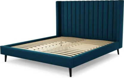 An Image of Custom MADE Cory Super King size Bed, Navy Wool with Black Stained Oak Legs