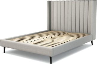An Image of Custom MADE Cory King size Bed, Ghost Grey Cotton with Black Stained Oak Legs