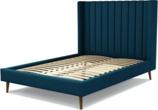 An Image of Custom MADE Cory Double size Bed, Navy Wool with Walnut Stained Oak Legs