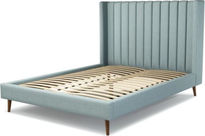 bbad91273bdd9fa1fa82e5a2bcc74bc2bb46f2a549de0dda66d108249ecaffac.jpg An Image of Custom MADE Cory King size Bed, Sea Green Cotton with Walnut Stained Oak Legs