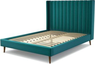 An Image of Custom MADE Cory King size Bed, Tuscan Teal Velvet with Walnut Stained Oak Legs