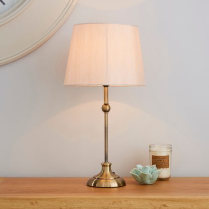 17a3fda225dd3b804b594d2d11a7553bd3e6605d41e0136ad412c885877a59a9-1.jpg An Image of Metal Ball Antique Brass Table Lamp Antique Brass