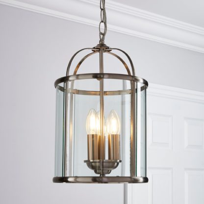 2cb136f5cda17802bf192a7bc43d49634c40d5a11feaea83f2045778eca9e27d-1.jpg An Image of Hurricane 3 Light Pendant Ceiling Fitting Brown and Silver