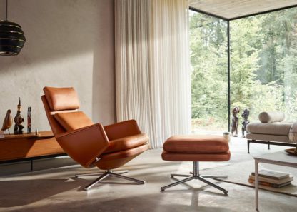 An Image of Vitra Grand Relax Lounge Chair Leather Cognac Polished Base Felt Glides