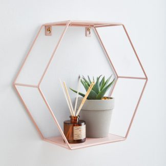 An Image of Hexagonal Blush Pink Wall Shelf Pink