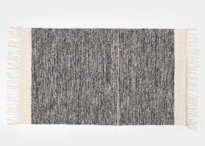 An Image of ferm LIVING Melange Mat Black 60 x 100cm