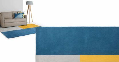 4ac16f5c480d1a2879a493c9a22a5feddd1bd85a9fbba0ae56df036e903f1434.jpg An Image of Elkan Tufted Wool Rug, Large 160 x 230cm, Block Blue