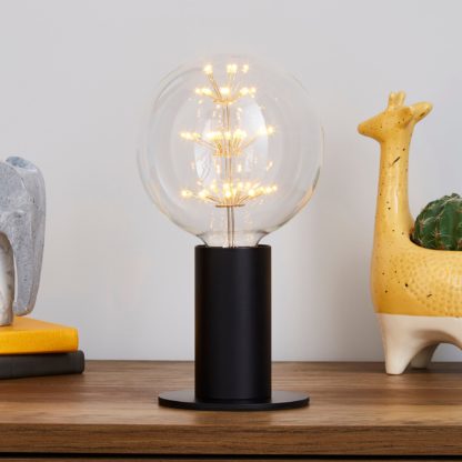 520d9d38664f072e1739c966349d3b8f9cc29bcf507ac68bdc80439388d4d271-1.jpg An Image of Eban Black Table Lamp Black