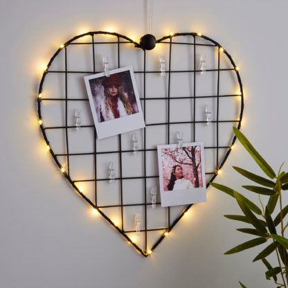An Image of Black Heart With Photo Pegs Light Black
