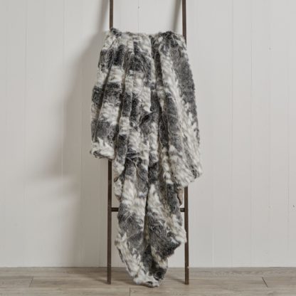 6cb76ccbb45655ac9289624b3c0779870b09432b5afa0fbca84cc81d6b8aa1e7-1.jpg An Image of 5A Fifth Avenue Deer Faux Fur 150cm x 200cm Throw Natural
