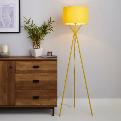 9481926e12b84fa57a449609832e67ee56cf4ca48ec97e6a7b420173d085e8d9-1.jpg An Image of Drei Tripod Ochre Floor Lamp Ochre