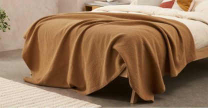 9b278bf4ed8996bcc9a6b1dc6669d2ac62e5dc517b24845ec93ca23b63a5e949.jpg An Image of Cael 100% Cotton Matelasse Bedspread, 150 x 200cm, Tobacco