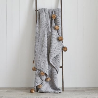An Image of Chunky Knit Faux Fur Pom Pom 130cm x 180cm Throw Grey