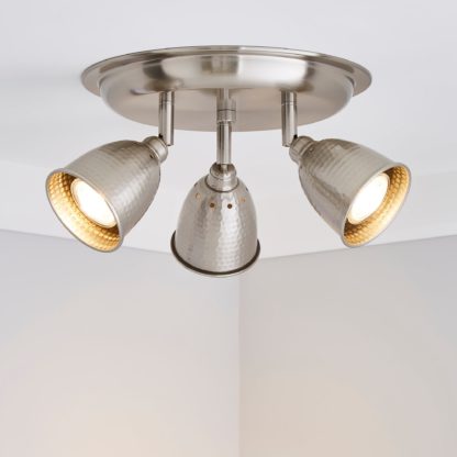 d63ff9f949f1f83fcb4aaf8947d2a119be3fa9e205f5819b29aaf079291a0fb7-1.jpg An Image of Filbert 3 Light Hammered Chrome Spotlight Satin Nickel