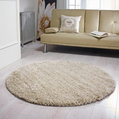 ebfc80d6c4a5e99a9ce07bdbd5906dc64d0a3de27f166374629f38038d2882fc-1.jpg An Image of Slumber Shaggy Circle Rug Natural