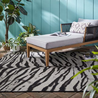 An Image of Saber Tiger Print Indoor Outdoor Rug Black and white