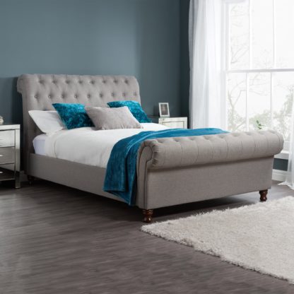 45390cf9aaa0acc408097b5400ae72d8fda37af454539b0480d44300d2d36e4b.jpg An Image of Castello Grey Sleigh Fabric Bed Frame Grey