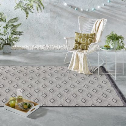 6273be589377cdfa8e240f9b12b6537c93913fb2e88c1f3fa7e6f33a3df9425d.jpg An Image of Tri Natural Indoor Outdoor Rug Grey, Black and White