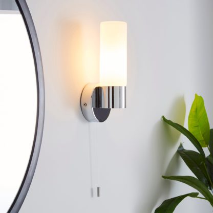6edfa2fec25fea2c1664e8fa19bab1348bac105753d978b8ca3523b9d8a8dad3.jpg An Image of Porto Frosted Glass Bathroom Wall Light Silver