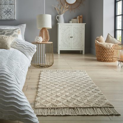 84a1709ab88b1733e2a4efa85b98991656ea824a732605b974ca30d29f135216.jpg An Image of Macrame Cotton 60cm x 110cm Rug Cream