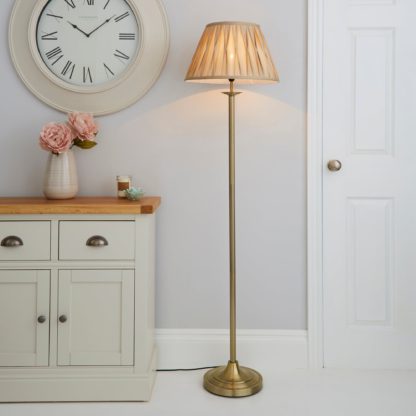 b8dd61a58f6e21ca7436b6681859ab502ae913ab0bd3ee681eb37cabea60b935.jpg An Image of Reeded Antique Brass Floor Lamp Gold