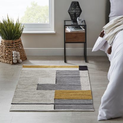 bd4c917a96745af246acd715af8e937bf0877b31781cb993e0949079f3c64d2b.jpg An Image of Abstract Rug MultiColoured