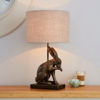 An Image of Hare Licking Paw Antique Brass Table Lamp Antique Brass