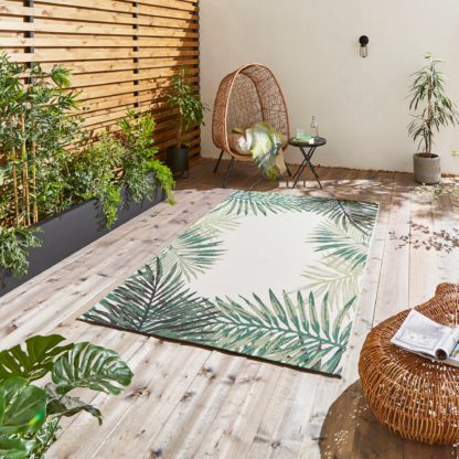 0f18b545e03ff3d6b75467353a42223bf2651a572151efcb3f5137f3b7ad3a85.jpg An Image of Miami Leaf Print Indoor Outdoor Rug Dark Green