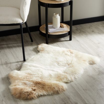 283162c7bf0d4bc7abcd43155a18b286995ab738e421daf30f1c529976362ce7.jpg An Image of Tanggula Natural Sheepskin Rug Natural (Brown)