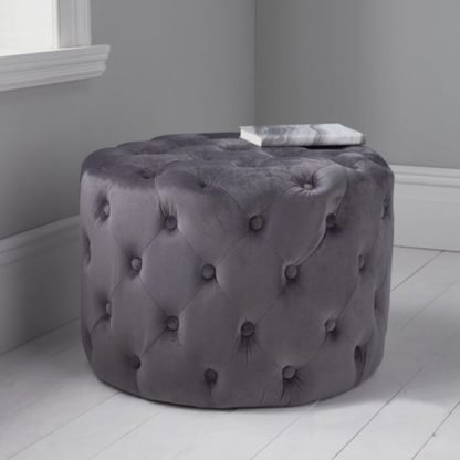 3202166fa2a91cfc16f9f96726b7c42ce26efdbd68606d742e946d1724104ea4.jpg An Image of Brea Round Tufted Velvet Pouffe In Grey