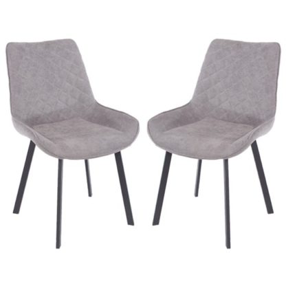 3d788cd6b7f54a8341d21bcd8a0d2f63886c2e1494f9cb1a0f3b9a2228a3bc6f.jpg An Image of Arturo Grey Fabric Dining Chair With Black Metal Leg In Pair