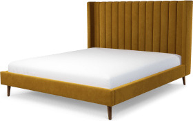 6f7e454acaa41bd496a1fbcc7ce258d476538e69f82eff63ccaa9db27c972e71.jpg An Image of Cory Super King Size Bed, Dijon Yellow Cotton Velvet with Walnut Stained Oak Legs