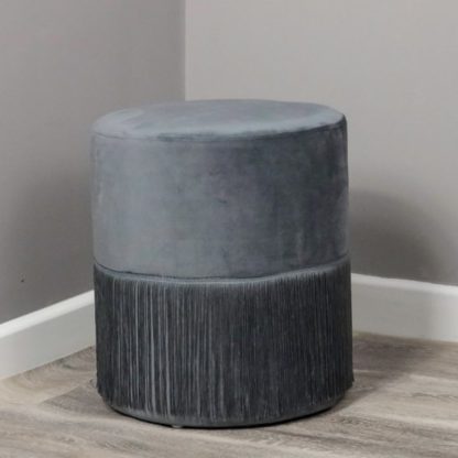 70c943a98f669b574c265c94a1df5cbe92f6cc747281179f93036a1559777fad.jpg An Image of Brunner Round Velvet Tassles Stool In Grey