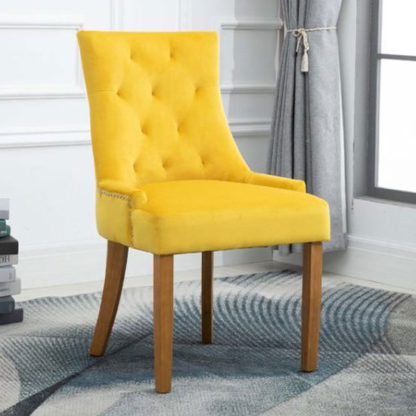 850bd3e21c19538383fd268b36822690b992981794a4087e432d48d25beebf06.jpg An Image of Lauren Velvet Dining Chair In Ochre With Oak Legs