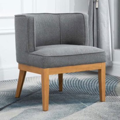 a9b577b8845513d25fbc198aa26f3e9b444ef4fc019a1d4e0d038529f7438c50.jpg An Image of Lucille Fabric Upholstered Armchair In Dark Grey