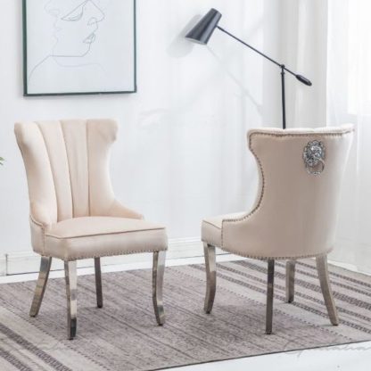 An Image of Monten Lion Knocker Cream Velvet Dining Chairs In Pair