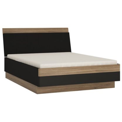 ec9e286048648bc88e08dad73745a62166f6ea23d2bc5cdab2688a7a1927f884.jpg An Image of Moneti Wooden Super King Size Bed In Stirling Oak And Matt Black