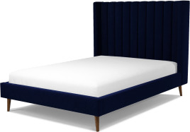 ffd3ee9dcc6ce0ade33ad425ec5f65bcbdb66beca21c85022378359b7e8a9940.jpg An Image of Cory Double Bed, Prussian Blue Cotton Velvet with Walnut Stained Oak Legs