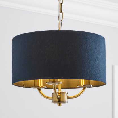 225e7c0096f67b7632d266ca259887411d5c540671176076cafd1e360b0f0646.jpg An Image of Preston Brass 3 Light Pendant Fitting Navy