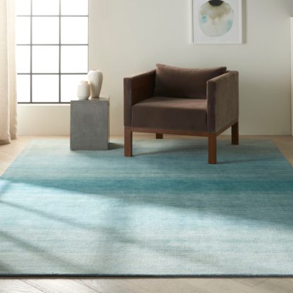 An Image of Calvin Klein Linear Glow Rug Green