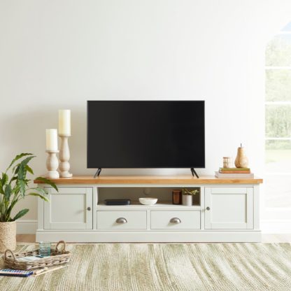 333a4e0a48cc09c0aec8c1c92620e706c7585f436eadeccf3df68ec440682719.jpg An Image of Compton Ivory Extra Wide TV Stand Ivory