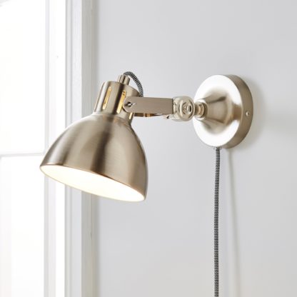 3445eac3a1976ae4ce06432cb00f62529aad524714d5d4c20228f461bd6e06f7.jpg An Image of Poppy Easy Fit Plug In Wall Light Satin Nickel Brown