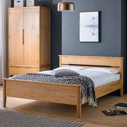 66f0a4965257790ca27dc625e2471176a694f0ae2049f8379070514515f3ee1e.jpg An Image of Harriet Wooden King Size Bed In Robust Solid Oak
