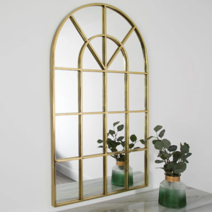 b93c747be4631662091de5ac93d7a8b85d542d2d7a712530d6fb2566540d5c47.jpg An Image of Manhattan Arched Window Design Wall Mirror In Gold Frame