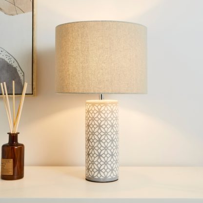 0cc64e49409bbe56c72b553a78eb5655375fa0c4a2e7a9aa6218af3fa740f219.jpg An Image of Geo Tile Ceramic Table Lamp Grey