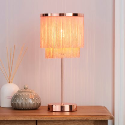 1b75f63637368a624bb6486af35608614d96a8f92da34bf0f3375998f1709b32.jpg An Image of Jaz Fringe Ivory Table Lamp Cream and Silver