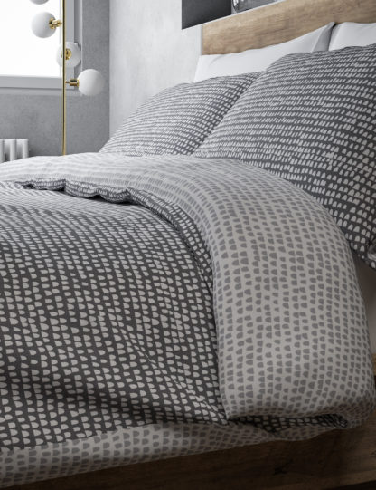 38111a0a2d96fa277d1979c8a26c751b708750be3f75acefddc713dea60ade43-1.jpg An Image of M&S Isla Geometric Bedding Set